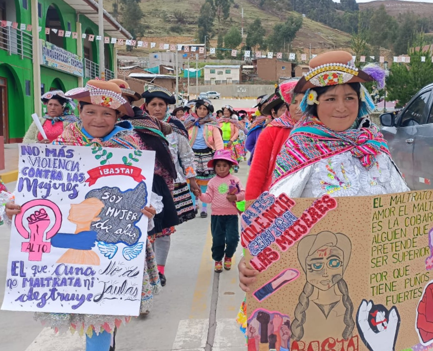 young women holding signs