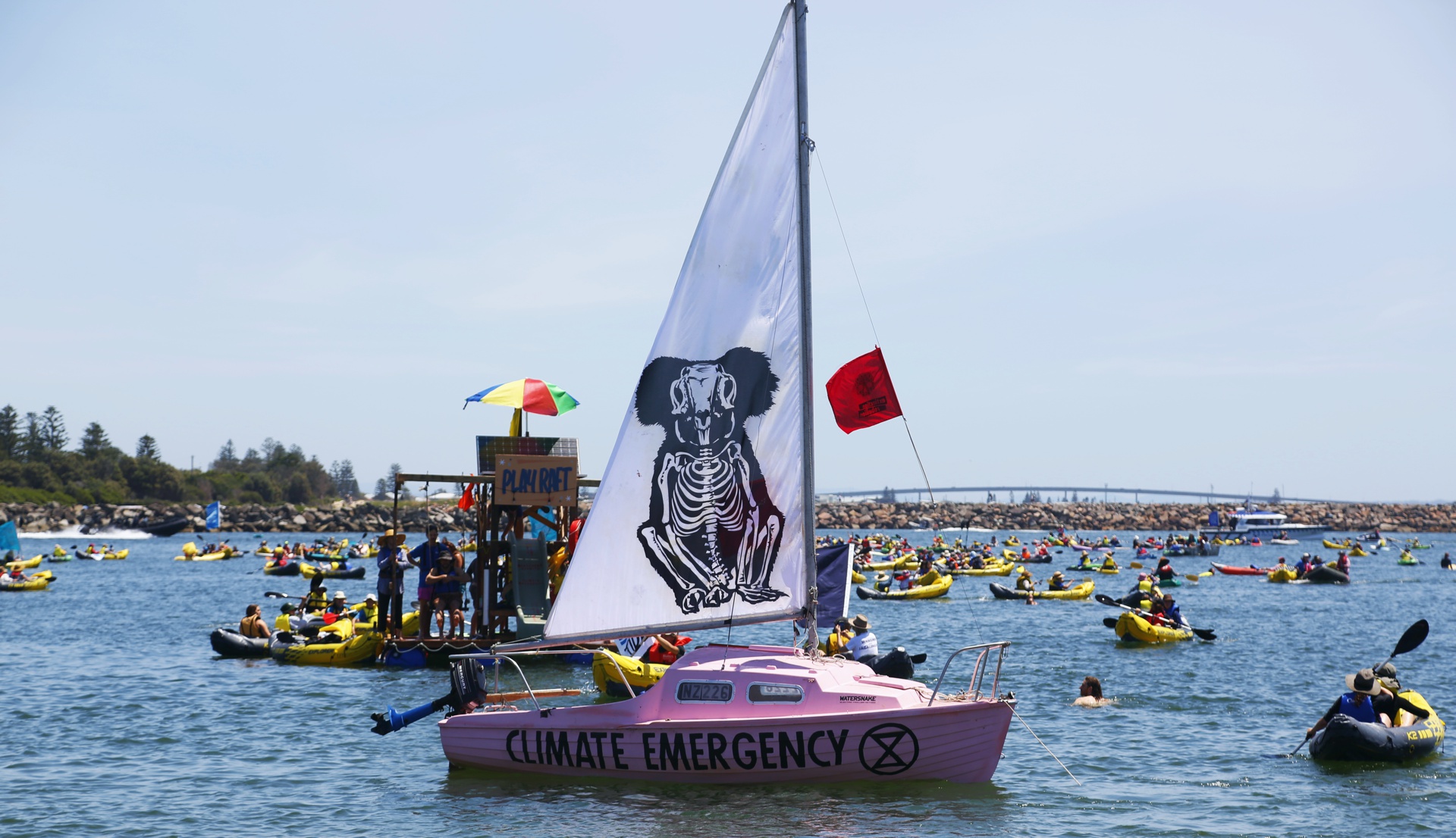 A line of kayaks crossed the whole channel