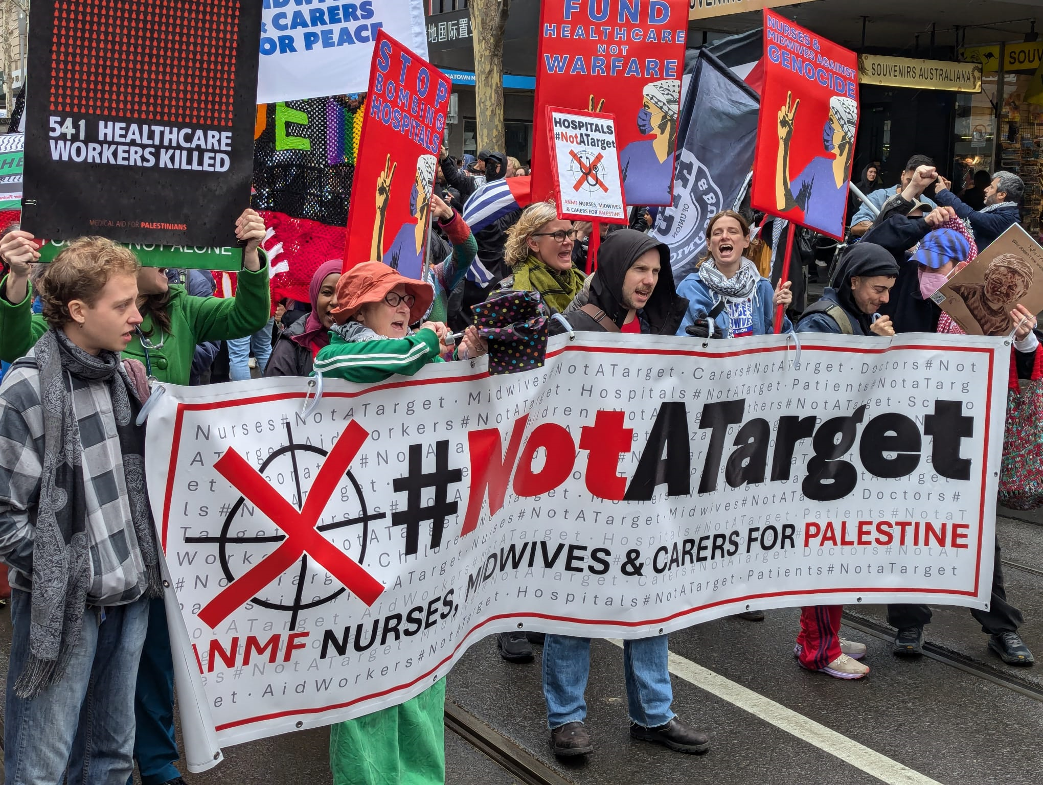 healthcare workers banner at palestine protest