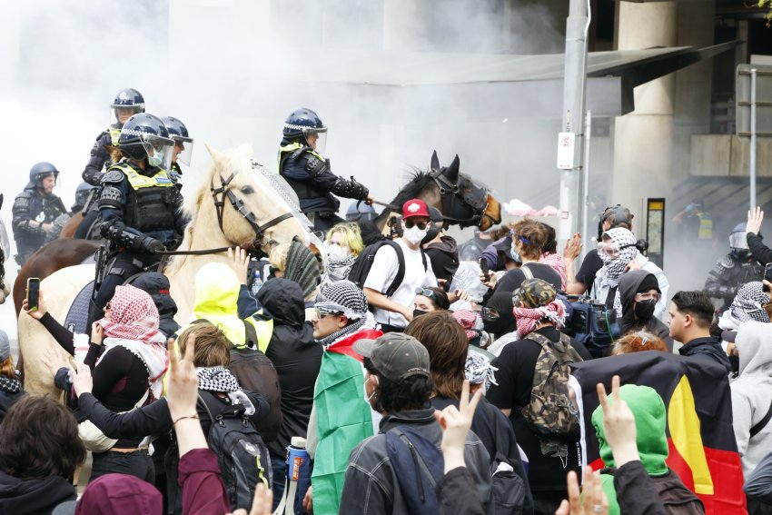 police horses charge protesters outside Land Forces