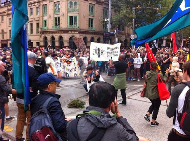 Melbourne Invasion Day rally occupies Flinders Street intersection.