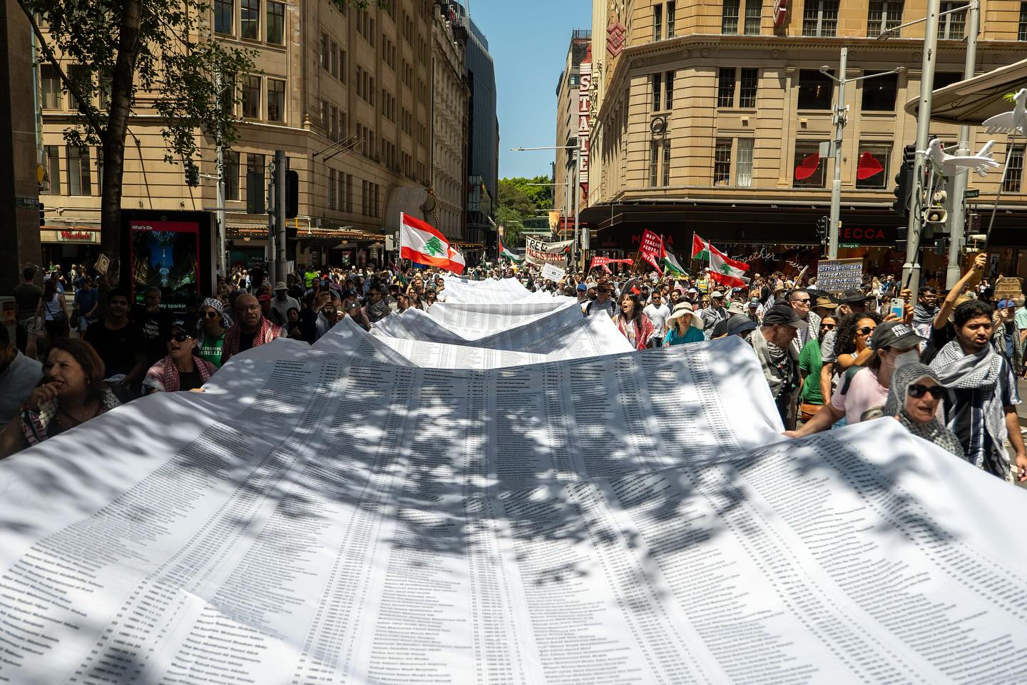 A giant banner spells out Gaza genocide, Gadigal Country/Sydney, December 22