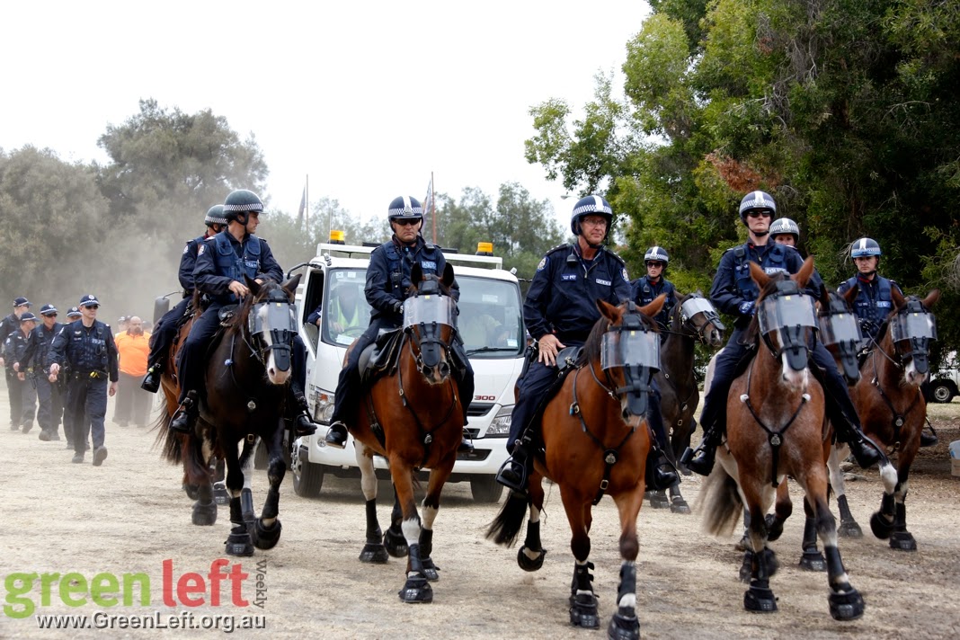 Police arrive at Matagarup Aboriginal encampment.