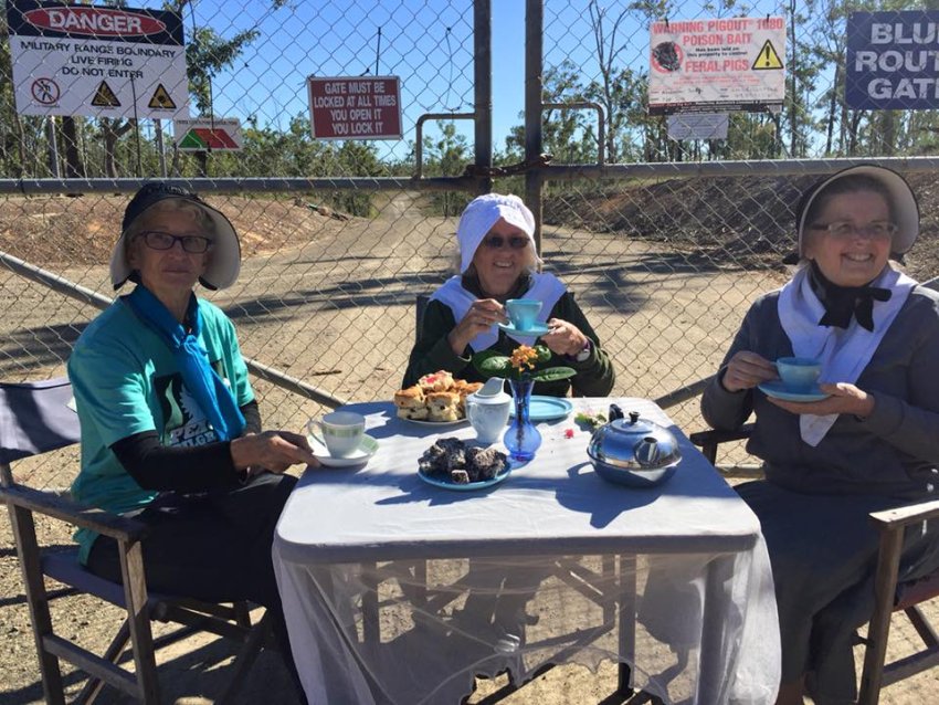 “Quaker Grannies for Peace” set up a tea table on July 13.