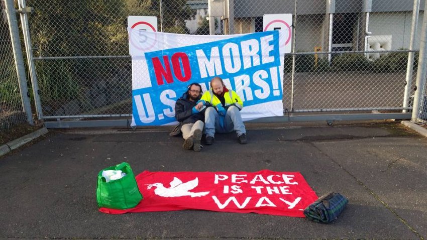 Greg Rolles and Shane Anders locked to Lockheed Martin's main gates on August 11, 2016.