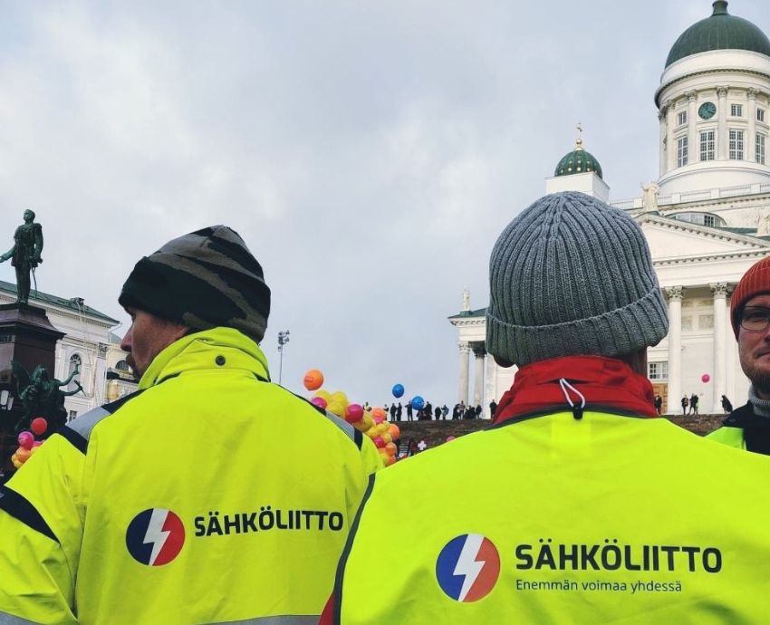 two workers at a protest