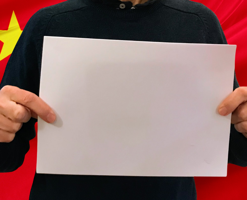 person holding a blank sheet of paper