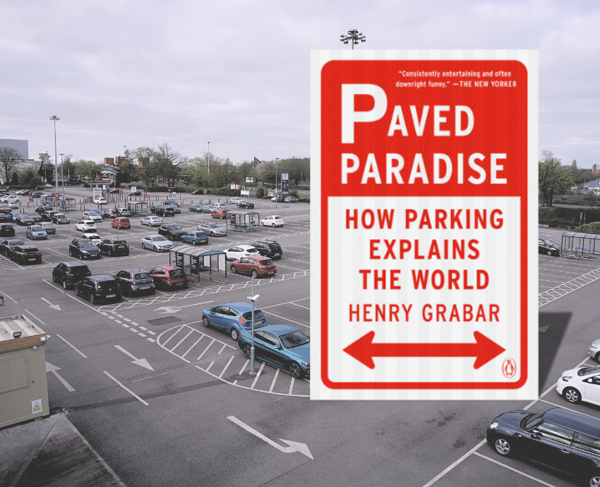 book cover against backdrop of parking lot