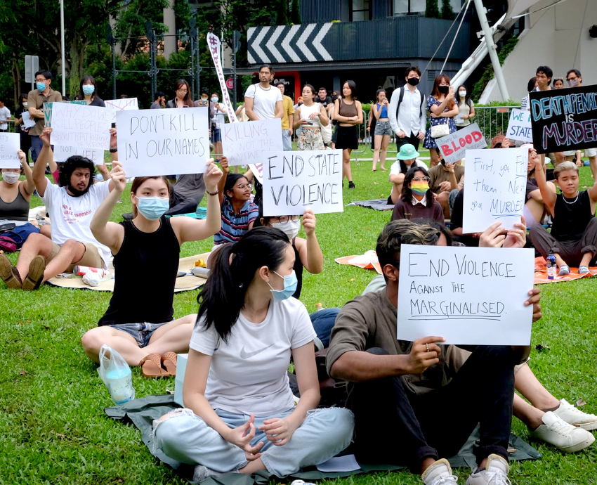 people holding signs