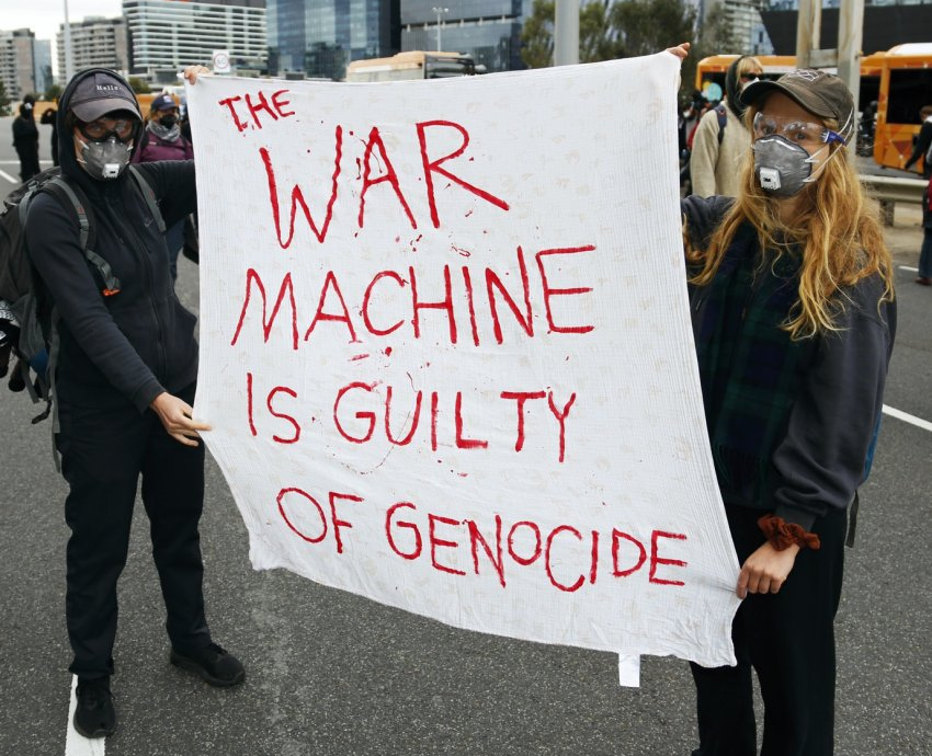 two people holding a banner