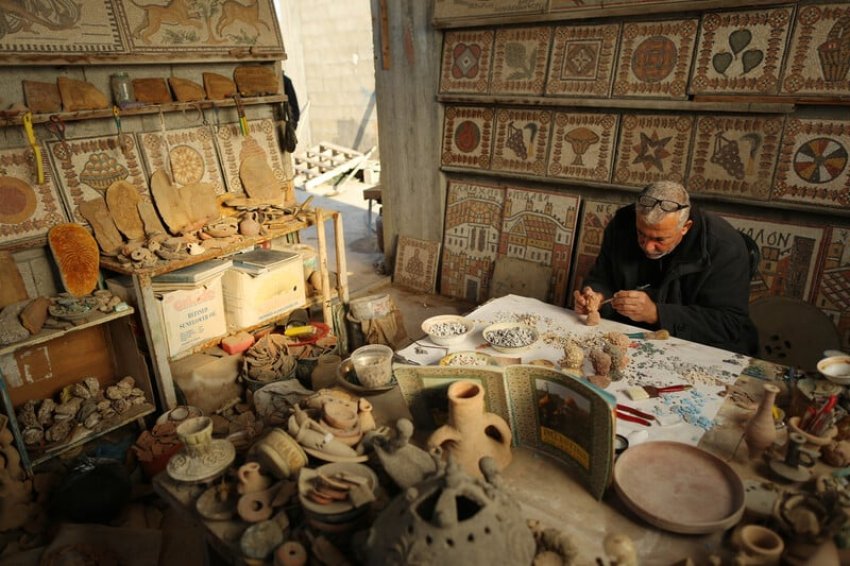 Nafez Abed at his Gaza rooftop workspace. Photo: Momen Faiz/Electronic Intifada.