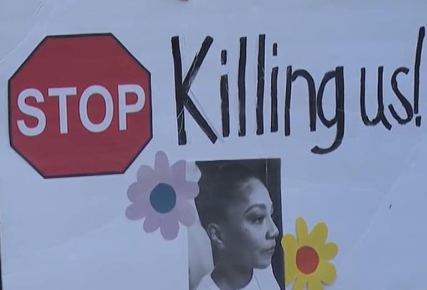 Sign with Sonya Massey's face reads "Stop killing us"