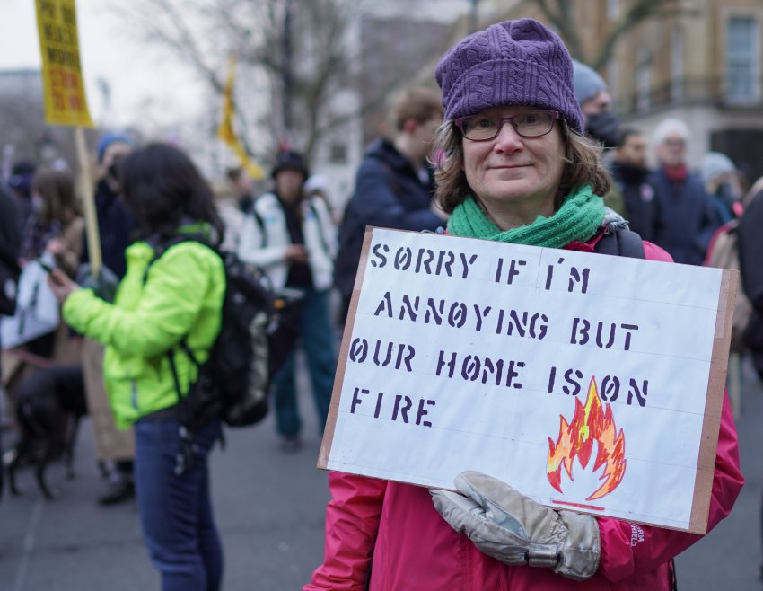 woman holding a sign at a protest