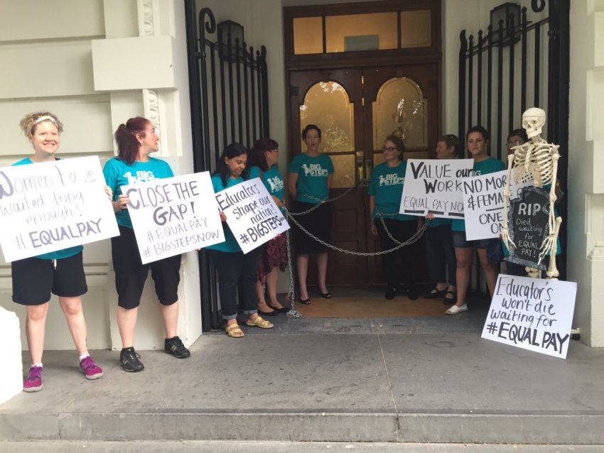 Childcare workers chained to the entrance of Malcolm Turnbull's Melbourne office on March 8, 2016.