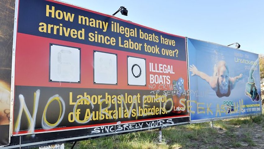 Defaced Liberal campaign billboard