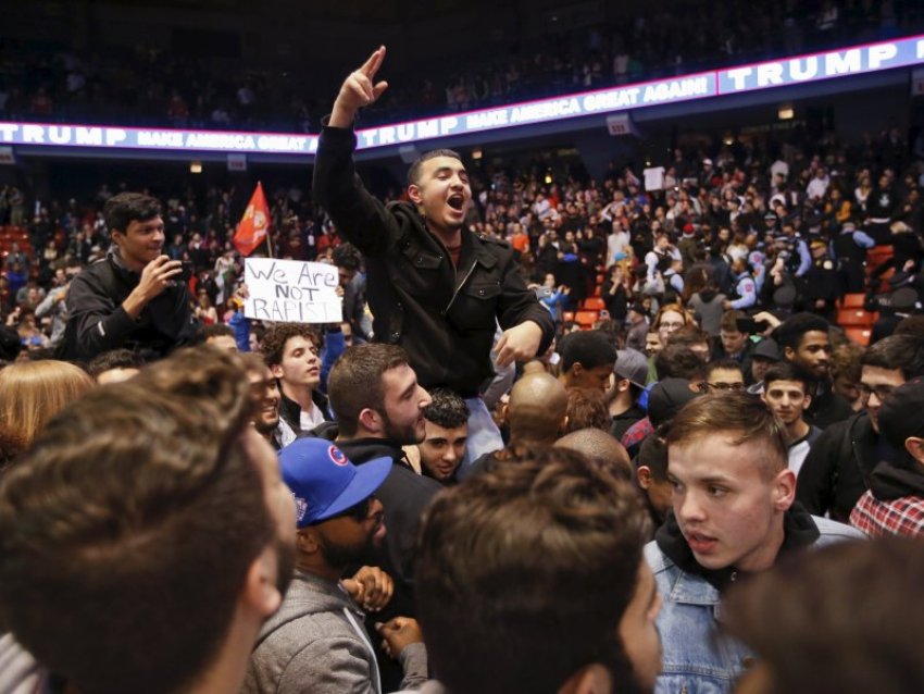 Demonstrators celebrate after Donald Trump cancelled his rally.