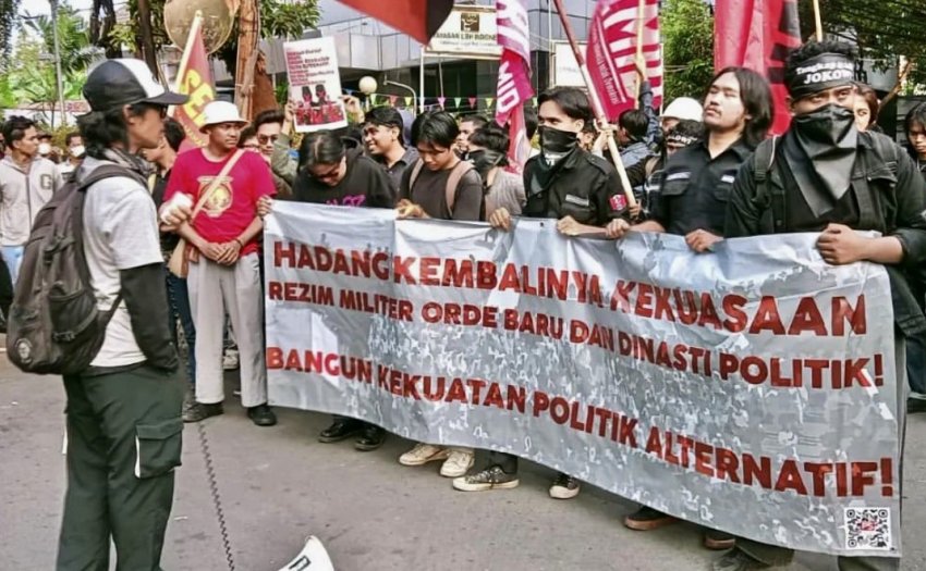 Protesters with a banner