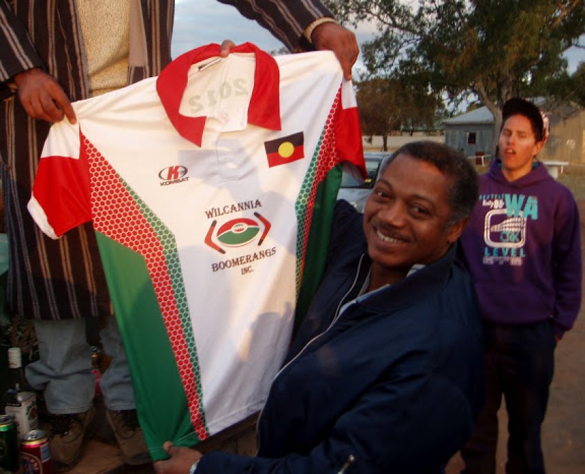 Jose Chala Leblanch presented with a Wilcannia Boomerangs footbal jersey.