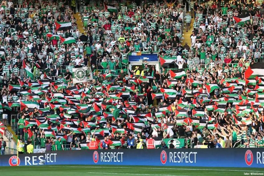 Fans of Scotland’s Glasgow Celtic FC display Palestinian flags.