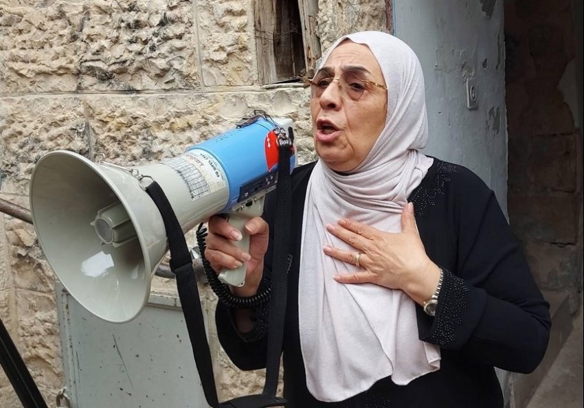 Palestinian woman with a megaphone