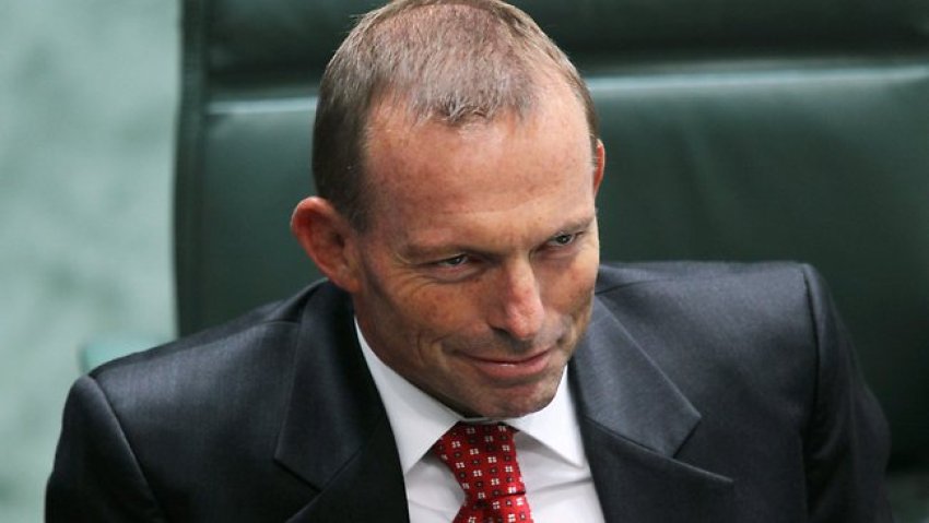 Tony Abbott smirking.