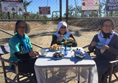 “Quaker Grannies for Peace” set up a tea table on July 13.