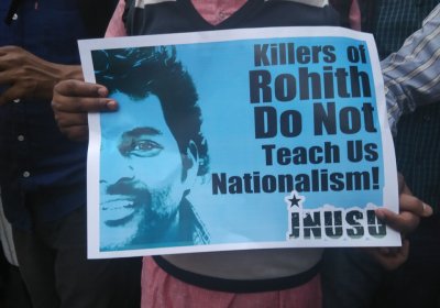 Protester holding sign condeming killing of Rohith Vemula.