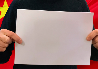 person holding a blank sheet of paper