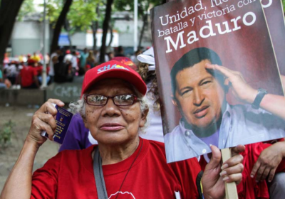 woman holding a sign and constitution