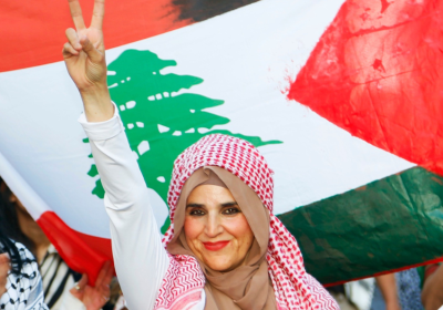 Protester in front of Lebanese flag