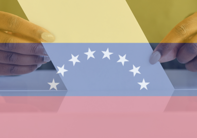 Venezuelan flag and woman voting