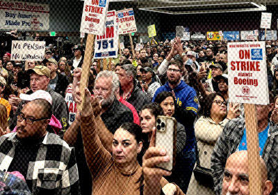 striking workers at a meeting