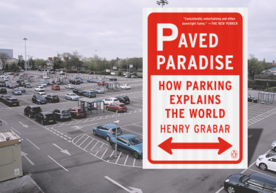 book cover against backdrop of parking lot