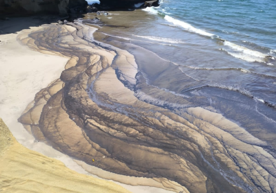 oil washed up on a beach in Peru