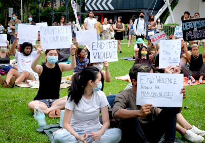 people holding signs