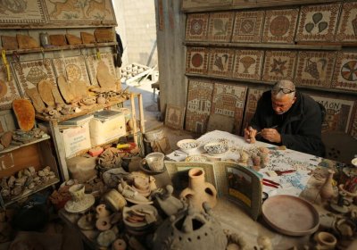 Nafez Abed at his Gaza rooftop workspace. Photo: Momen Faiz/Electronic Intifada.