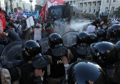 police spray protesters with tear gas
