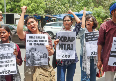 protesters holding signs