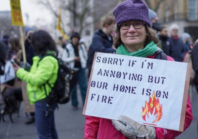 woman holding a sign at a protest