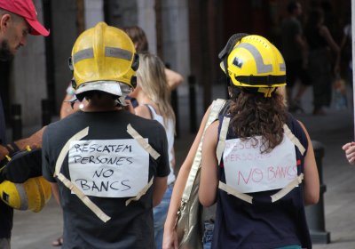 Firefighters take part in a 400,000-strong protest in Barcelona against austerity, July 19.