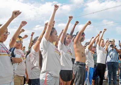 People against the Dakota Access Pipeline chant in opposition.