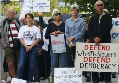 Defend whistleblowers, defend democracy - protesters outside the ACT Supreme Court on November 13