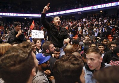 Demonstrators celebrate after Donald Trump cancelled his rally.