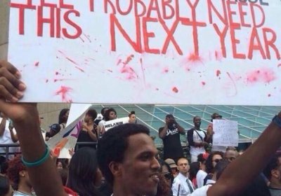 Protester holding placard at Black Lives Matter protest.