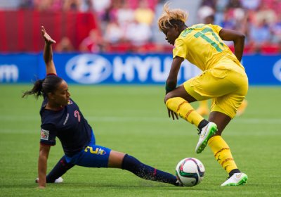 Gaelle Enganamouit (right) led her team to a dominating 6-0 victory over Ecuador on June 8.