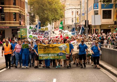 These Cuts Are Killing US rally in Sydney. Photo: Zeb Parkes.