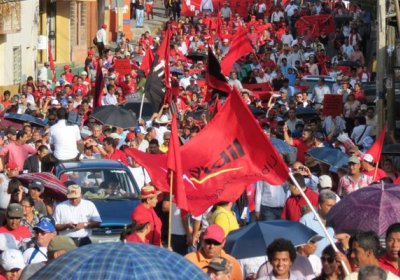 Libre supporters march through the streets of Honduras.