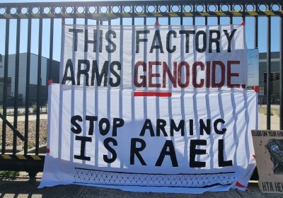 A banner hanging from the gates of the HTA plant in Naarm/Melbourne.