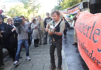 John Butler performs at a protest outside BHP Billiton's Melbourne headquarters, October 5.