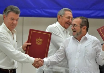 Colombian President Juan Manuel Santos and FARC commander Timoleon Jimenez at a signing ceremony in Havana, Cuba for a historic ceasefire in June.